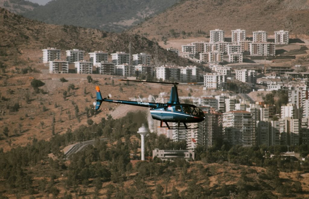 Helicopter Flying over Town