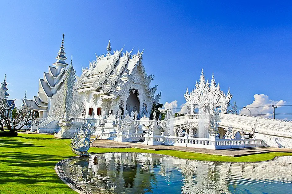 Popularly known as 'The White Temple', Wat Rong Khun is the architectural epitome of visual artist and painter Chalermchai Kositpipat. Painted white and fitted with shiny glass, this Buddhist temple shines in the sun.