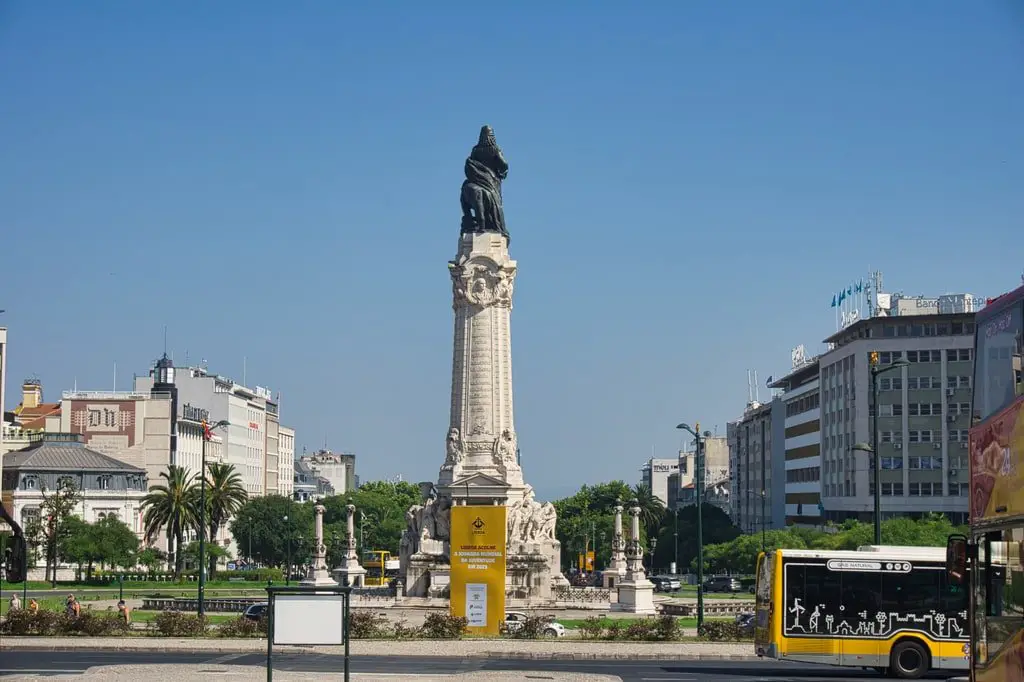 A city bus passes Lisbon's Marquis of Palombal Square.
