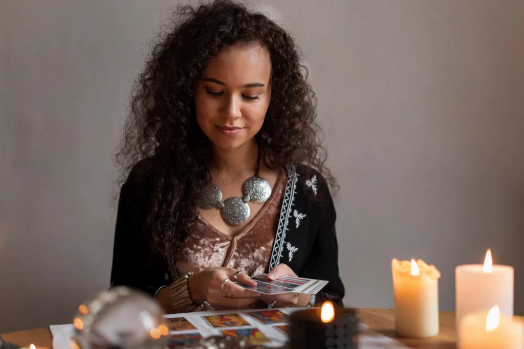 medium-shot-woman-reading-tarot-home